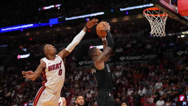 Brooklyn Nets guard Lonnie Walker IV (8) shoots the ball against Miami Heat guard Josh Richardson (0)